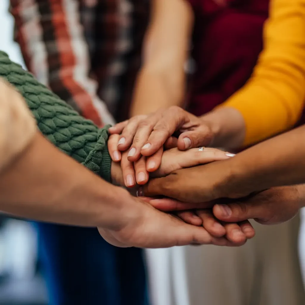 Hands together celebrating
