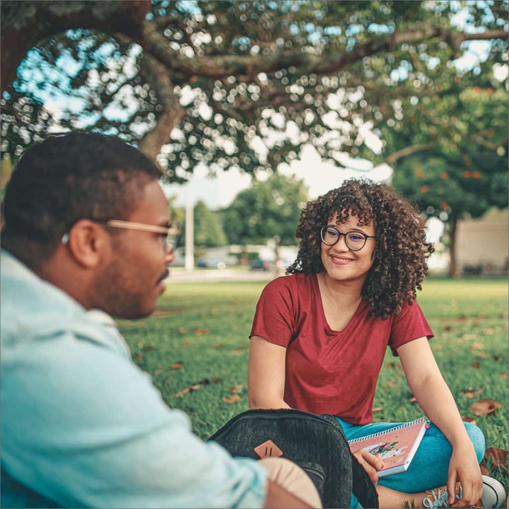 people sitting in park talking