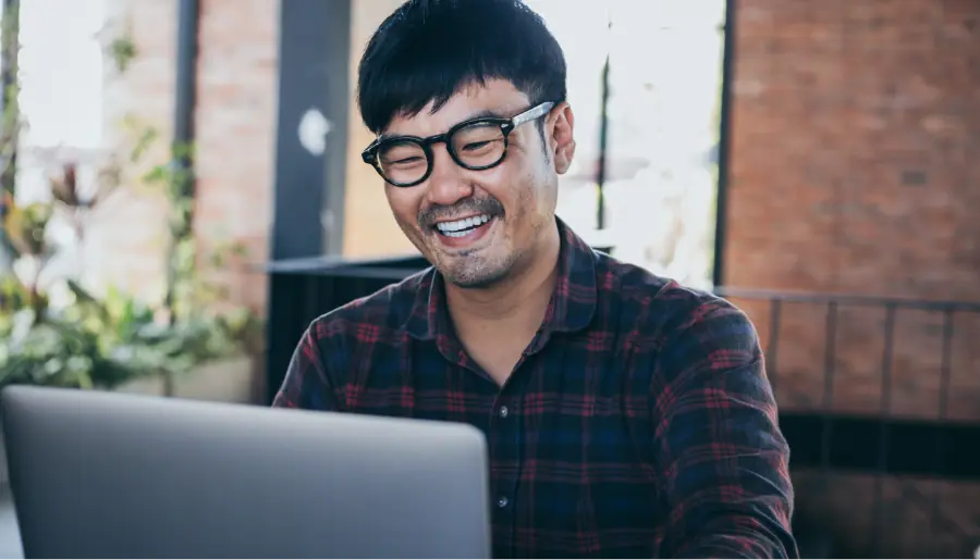 happy man work using computer hand typing laptop