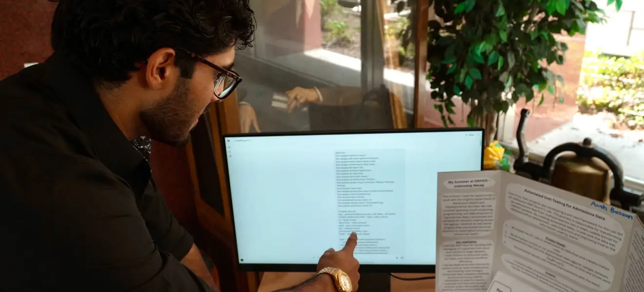 DBHDS intern looking at screen